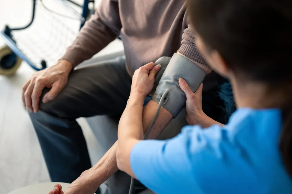 Nurse taking blood pressure